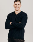 Man wearing a dark colour v-neck sweater