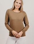 Woman wearing a light brown Classic Cervelt Scarf - Kapeka NZ, Made from New Zealand Red Deer Fibre. Very Soft and rare Fibre. Only made in New Zealand