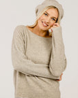 Woman wearing a beige Classic Merinosilk Beret Hat - Kapeka