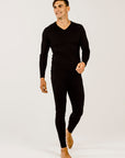 Person wearing black leggings on a white background