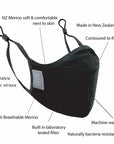 A black travel mask with adjustable elastic straps, made from merino soft & comfort next to skin, with a label showing 'Made in New Zealand', and highlighting features such as 100% breathable, adjustable elastic straps, and a machine washable filter.