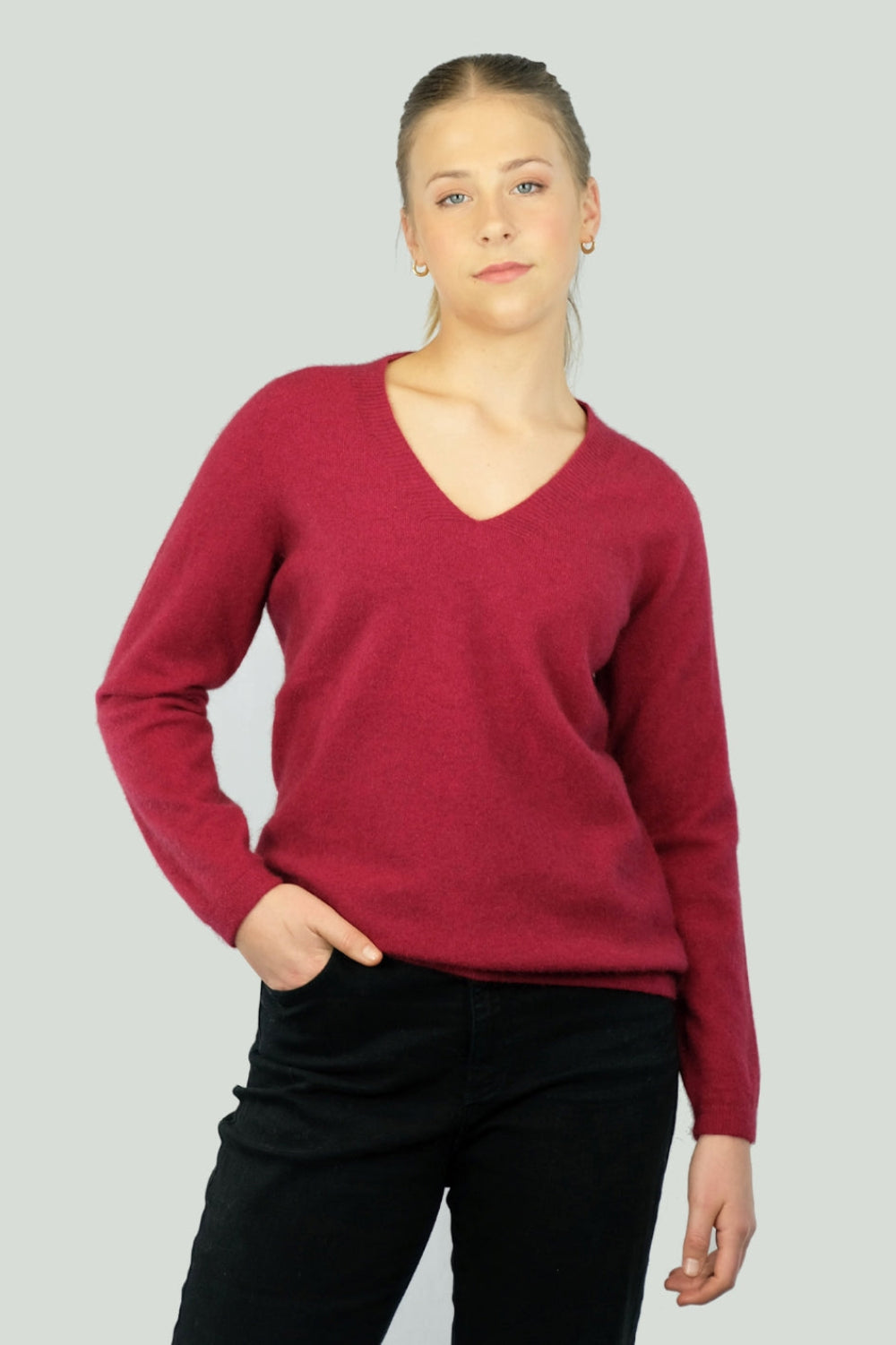 Woman wearing a red v neck sweater