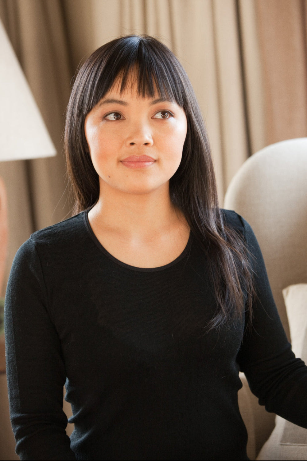 Women wearing a black merino thermal base layer top
