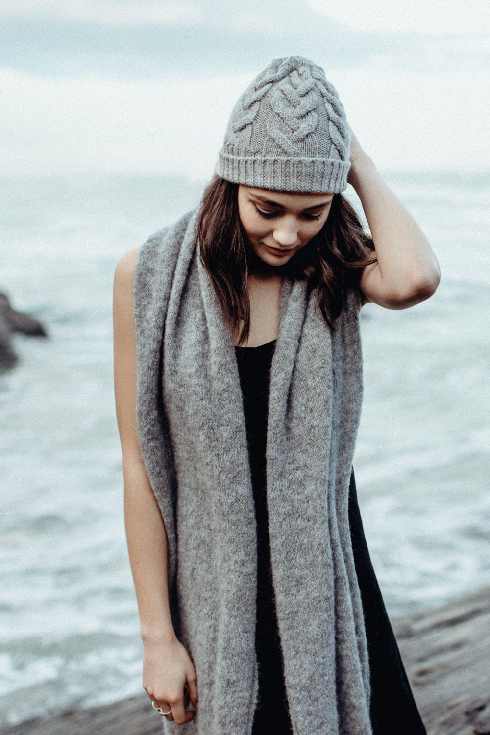 Woman wearing alpaca beanie at beach