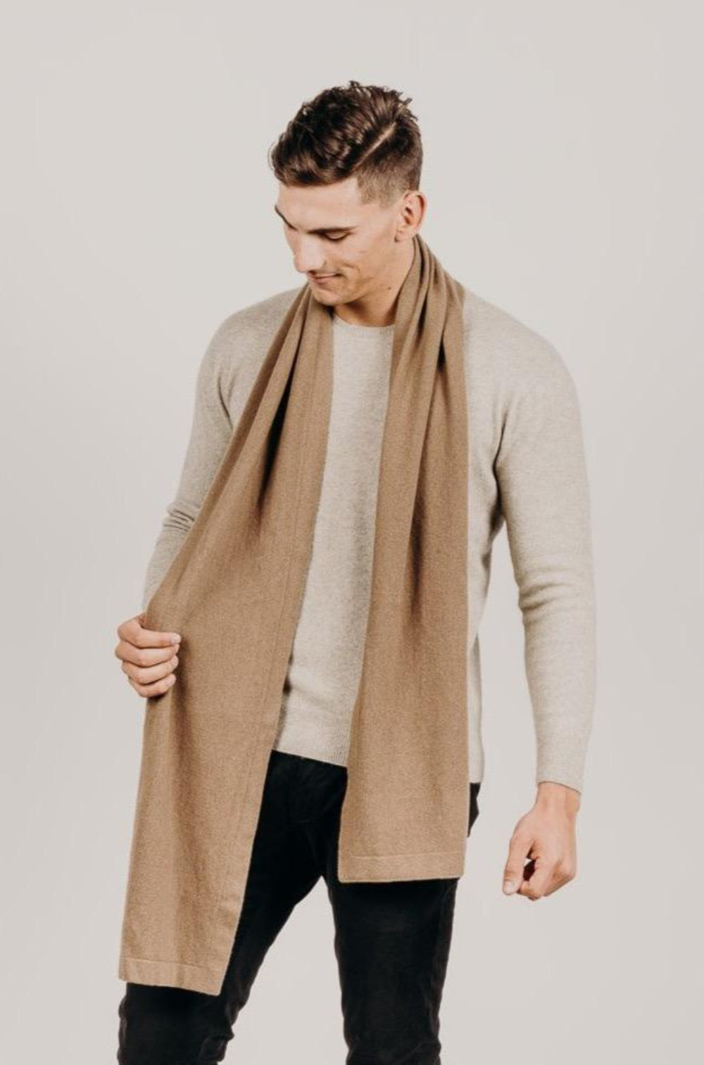 Man wearing a light brown Classic Cervelt Scarf - Kapeka NZ, Made from New Zealand Red Deer Fibre. Very Soft and rare Fibre. Only made in New Zealand