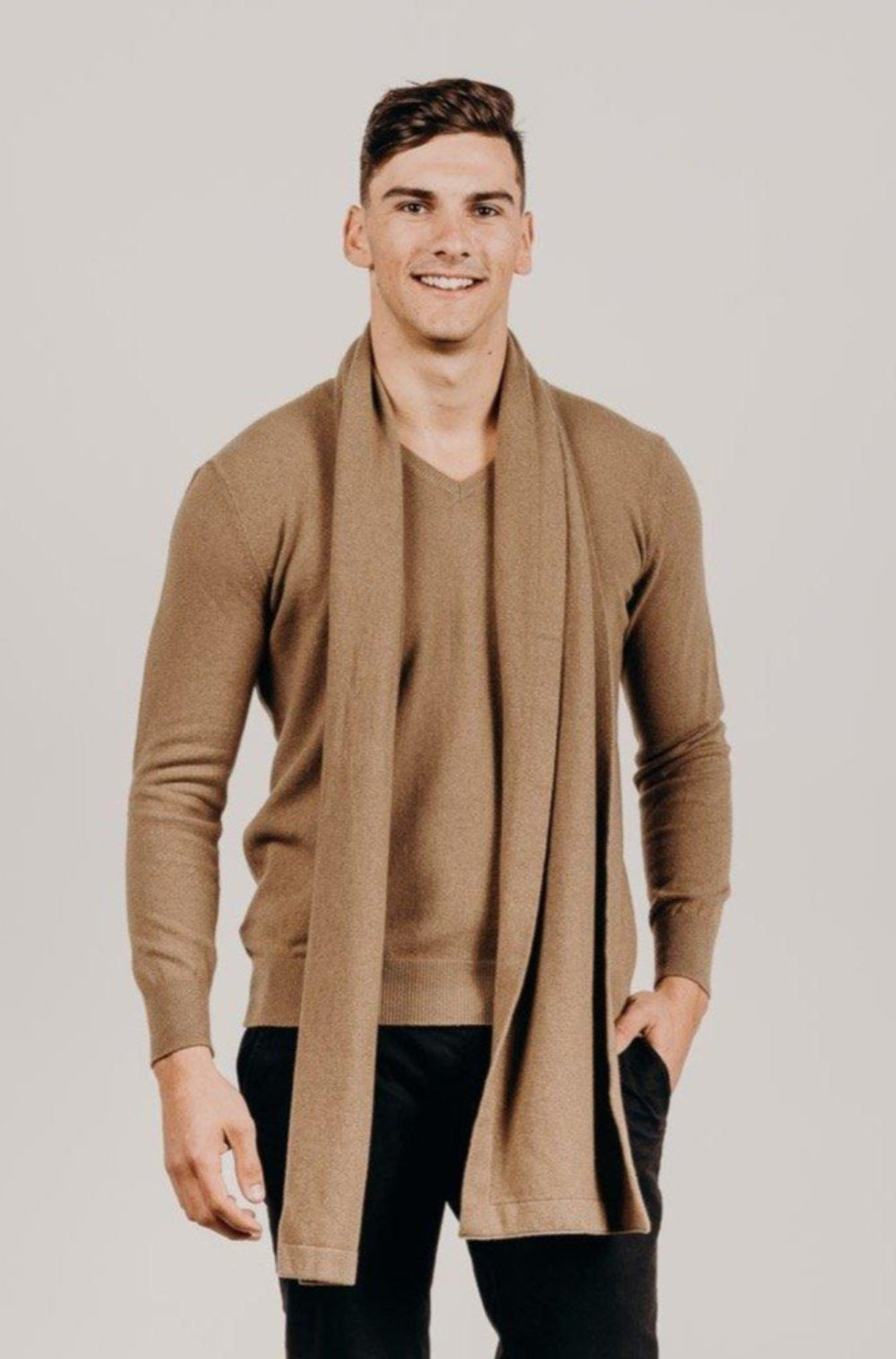 Man wearing a light brown Classic Cervelt Scarf - Kapeka NZ, Made from New Zealand Red Deer Fibre. Very Soft and rare Fibre. Only made in New Zealand