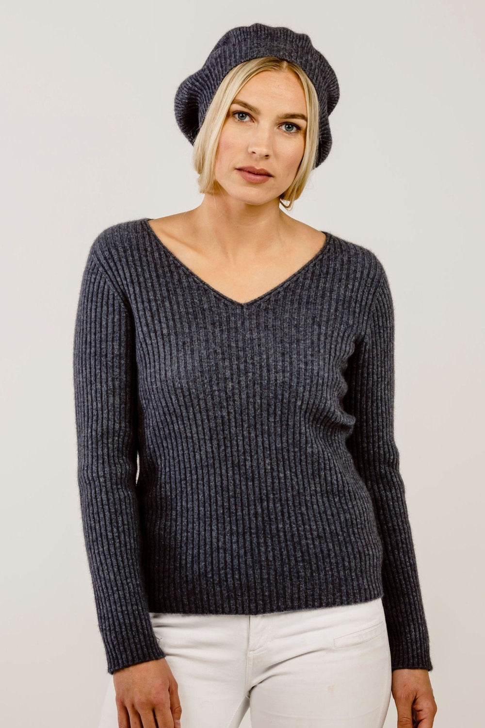 A woman wearing a grey Merinosilk beret hat.