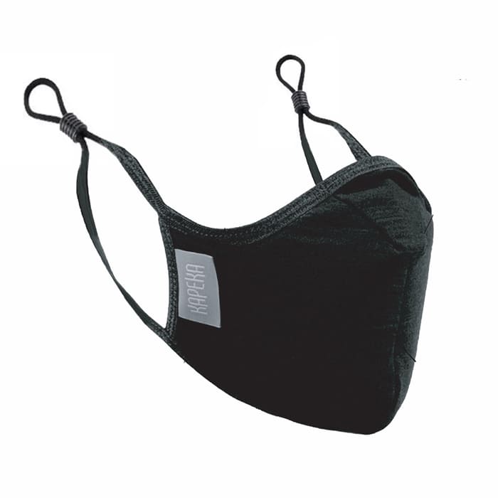 A black travel mask with adjustable elastic straps, made from merino soft & comfort next to skin, with a label showing 'Made in New Zealand', and highlighting features such as 100% breathable, adjustable elastic straps, and a machine washable filter.